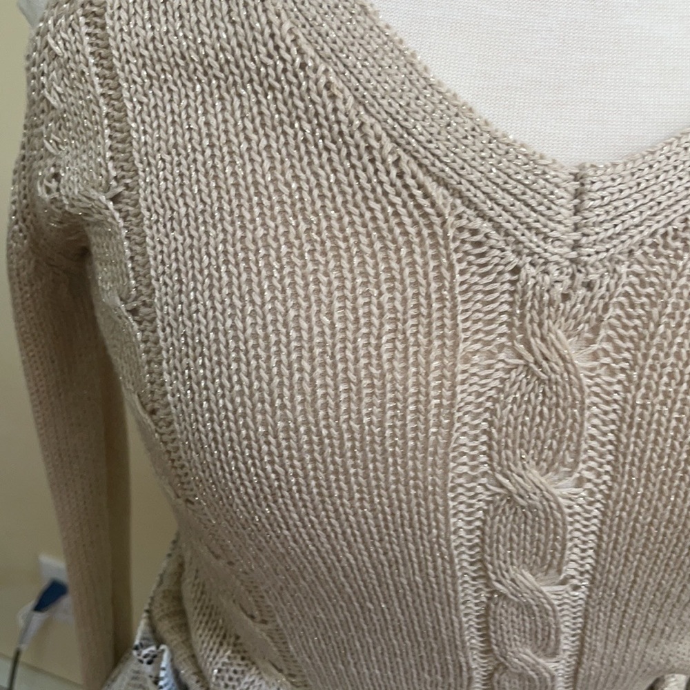 Bebe cold shoulder sweater has a slight shimmer to it